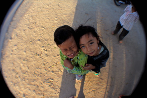 My neighbors Silvie and Dwi take a break from poking local trees for their Javanese cherries, or&nbs