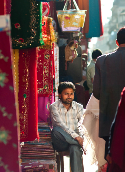 Cloth shopkeeper in Thamel, Kathmandu, Nepal. Photography by BrookR