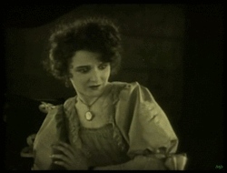  Mary Philbin is imprisoned by Lon Chaney