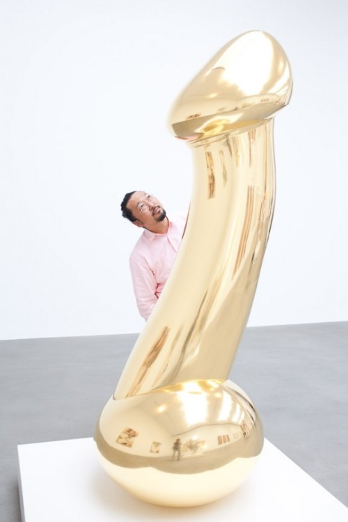 Takashi Murakami and one of his sculptures.