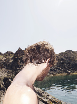 His beard resembles the background scenery.