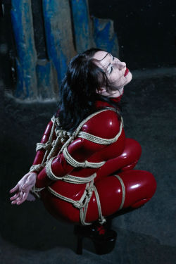 Sensualhumiliation:  Blood Red Latex Body Suit And Such Kind Of Rope Bondage Is Just