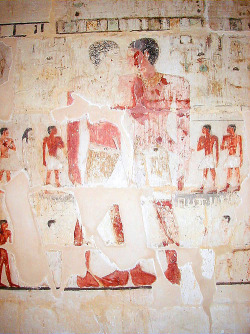 100artistsbook:  This Egyptian rock painting was found inside the tomb of Khnumhotep and Niankhkhnum, and dates to some time around 2400 BCE. It depicts the two men holding hands, surrounded by their children - the traditional pose of a married couple.