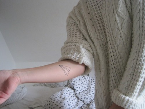 brown-wavyhair:   mangoflower:  discoskeletons:  whenyourunaway-blog: “My first tattoo on my right arm. It’s a paper airplane and it’s the symbol of the travel of life. You start somewhere and don’t know where you end up and so on. It’s that