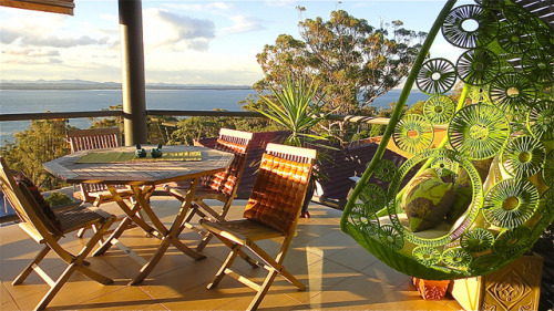 Green hanging chair in Nelson Bay, New South Wales, Australia (by sccart).