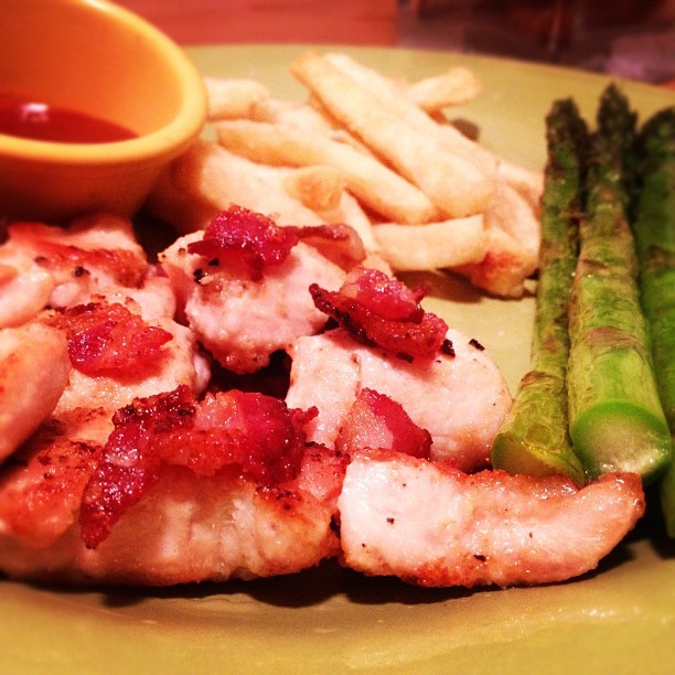 Some chicken sautéed with bacon bits, asparagus sautéed with leftover bacon grease and baked yucca fries with no sugar ketchup for dipping. #paleo #bacon #ilovebacon #veggies #eatright #eatclean #healthy #nutrition