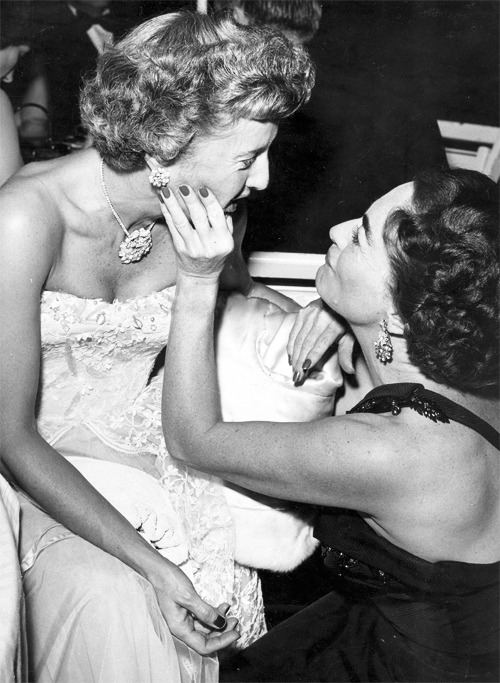 jeanarthur:  Joan Crawford giving her friend Barbara Stanwyck a “chin up” admiration after