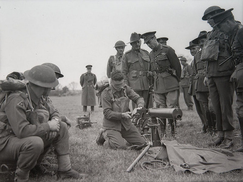 lifeisavapour:King George VI inspects Australian soldier assembling Vickers machine gun whilst blind