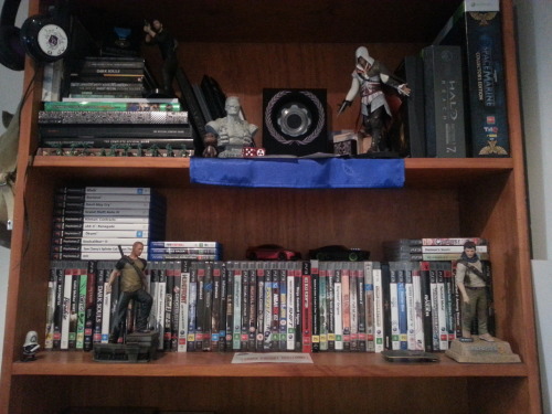 fuckyeahbatmanuniverse:  For Cara, I give you: The Wall. Games covered up by statues in top photo. - Darksiders, Destroy All Humans, Deus Ex: Human Revolution, Devil May Cry 4, Vanquish, Virtua Tennis 4, Yakuza: Dead Souls. 