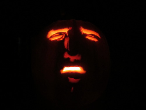 starlightexcellent:  My roommates and I carved pumpkins. I made this one.  Here it is with a candle.  Happy Halloween. 