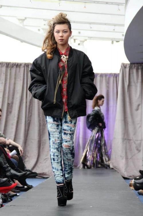 Shannon wears FashionCREEP custom bleached denim leggings and shredded tartan shirt, vintage black b