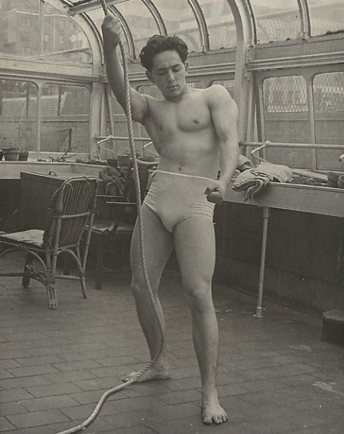 Unknown (American), Male Model Posed Pulling a Rope in Anna Huntington’s Rooftop Studio, 1950s