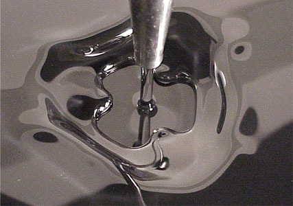 fuckyeahfluiddynamics:Hydraulic jumps occur when a fast-moving fluid enters a region of slow-moving 
