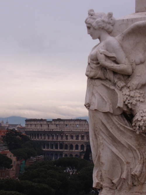 jpino9:Statue, Piazza Venezia overlooking the Colosseum, Rome