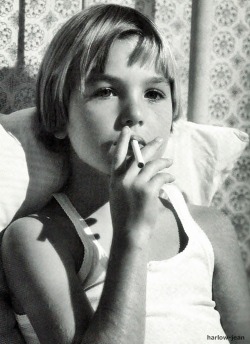 oldhollywood-glamour:  Tatum O’Neal (age 9) puffs away in Paper Moon. (1973) The actress admitted she had already been smoking secretly for 3 years. 