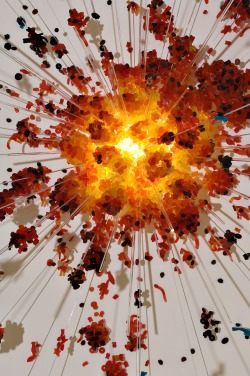 shin-sekai:  A delusory image. An explosion composed by a lightbulb and tons of red, orange and yellow gummy bears and worms