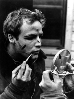  Marlon Brando shot as he applies his makeup for his role as Terry Malloy in Elia Kazan’s On the Waterfront - photographed by John Springer (1954) 