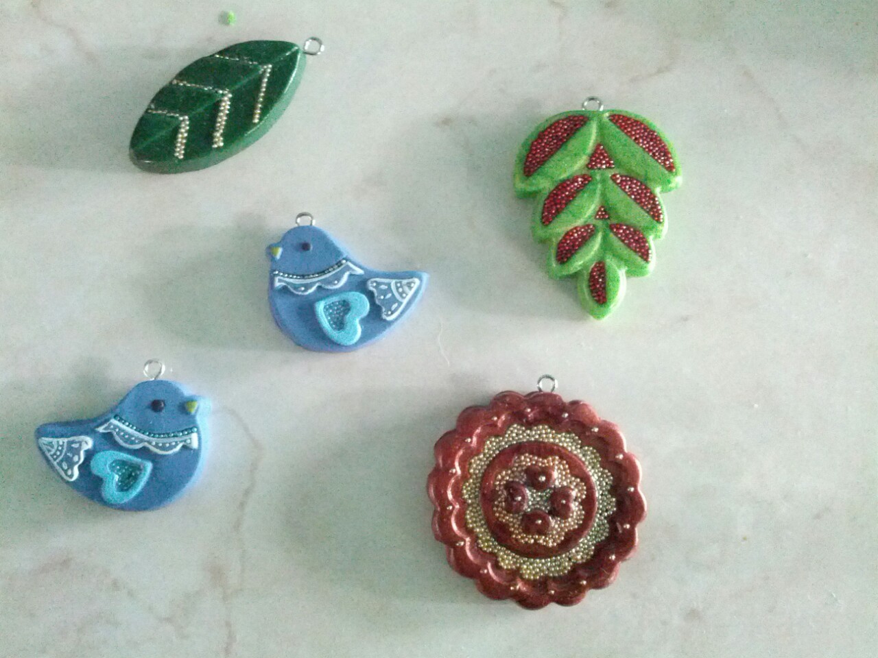 More pendants!  These are polymer clay with details in carefully placed micro beads