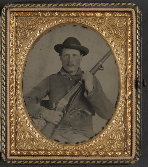 gunsandposes:Civil War portrait photography: “Unidentified soldier in Confederate uniform with Berda