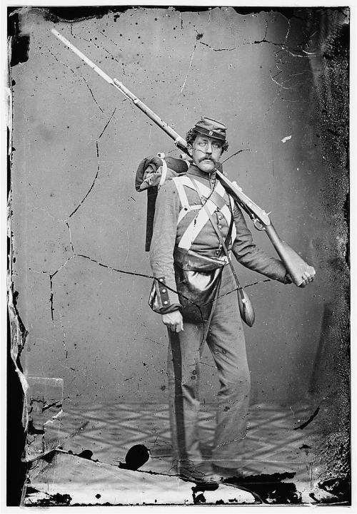 gunsandposes:Studio photograph of an unknown Union Soldier during the Civil War.(Library of Congress