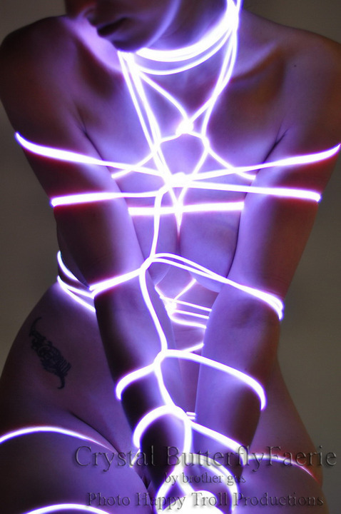 secretdaddy: societyconstructedcunt: blaqkfish: Glow wire bondage. Submissive circa 2120?