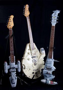 assorted-goodness:  Star Wars Guitars Created by Tom Bingham (via: mahlibombing, RetroStarWars &amp; The Sun) 