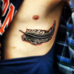 fuckyeahtattoos:  This was done by Michael Wilson at Body Art From the Needle in Newbern, Tennessee. I got this in memory of my grandfather. He always said he was going to come back as a bird after he died and we always find a feather when we visit his