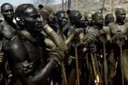 dynamicafrica:  Kao-Nyaro men from the waiting to take part in a match.  They wear lethal bracelets, each weighing 2 kilos with two inch double flanges.  Kordofan, Sudan. 1949. 