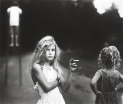 svburb:  ofjericho:  confhetti:   she isn’t a smoker, i watched a documentary about the photographer, this is her daughter and she always would take photos of her children and she thought of how out of place yet powerful the cigarette would look in