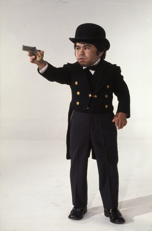 gunsandposes:Hervé Villechaize poses as evil henchman Nick Nack in a publicity still for The Man wit