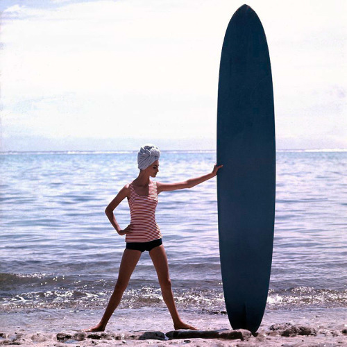 Model Catherine and her surfboard; photo by Georges Dambier; Biarritz, France, 1959.