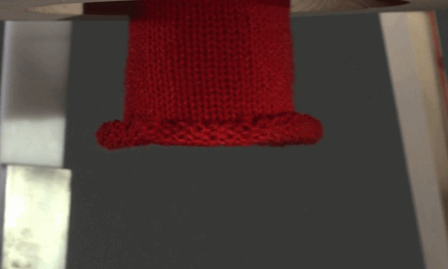 prostheticknowledge:Rocking Knit A rocking chair-powered knitting machine that can make winter hats,