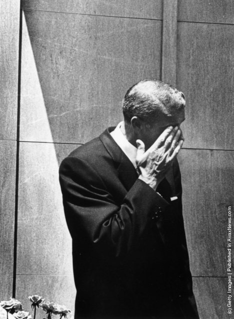 Joe DiMaggio (1914–1999) wipes a tear from his eye after bursting into tears at