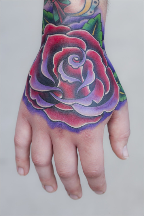 fuckyeahtattoos:  this beautiful traditional rose on hand was done by Jon Goad at Born This Way Body Arts in Knoxville, TN