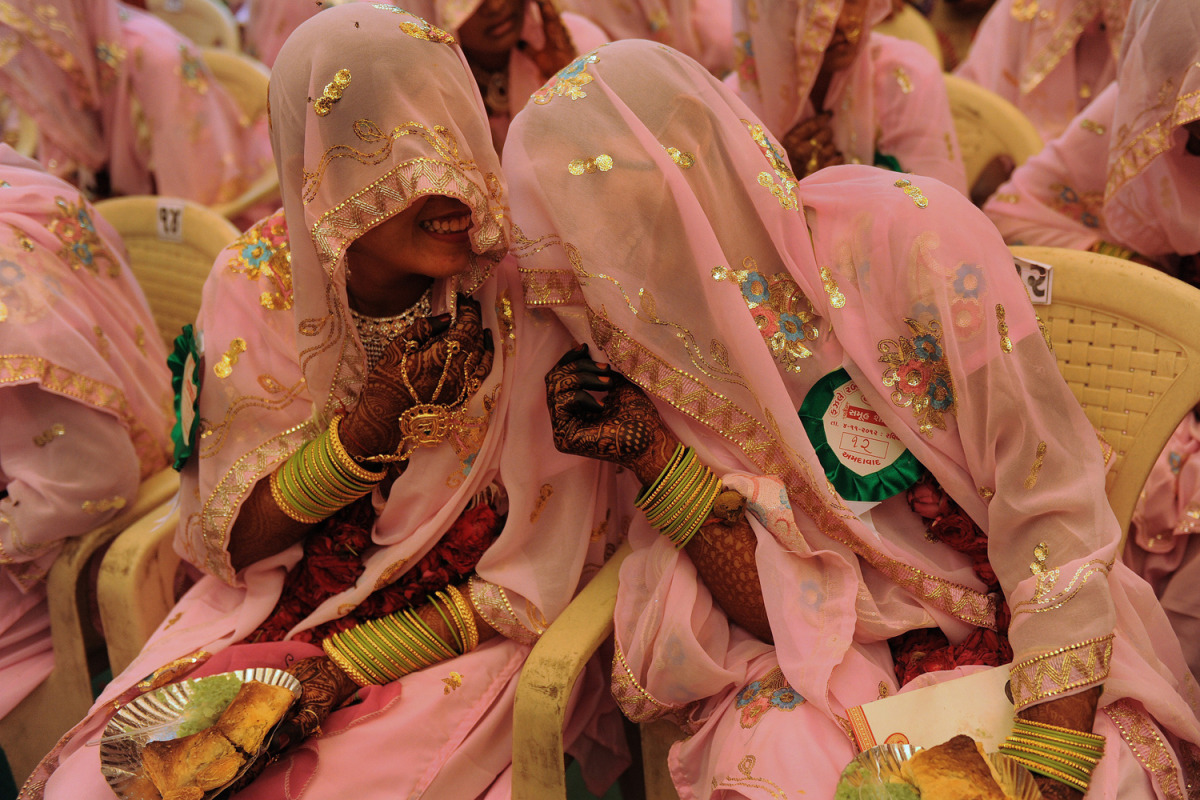 diamonds-wood:  Nov. 4, 2012. Indian Muslim brides chat as they wait for the start