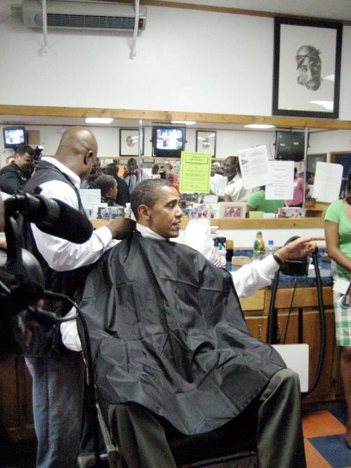 thuglife-thugzmansion:  mrmoses717:  President Barack Obama getting a haircut & talking to supporters. 2pac hanging on the wall……    