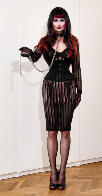 sissyclarrise:  dominiqueq:  sweetnathalietv:  Today’s mood: please yet unknown mistress, take this leash…  What lovely presentation, chastity, tight corset, heels and OTT make up for extra humiliation, just perfect for private clubbing and all round