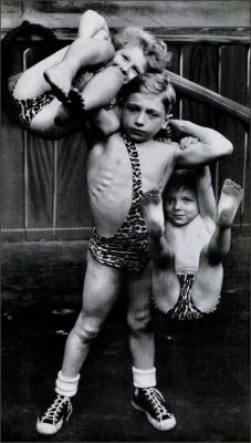 1950sunlimited:  Strong Man, 1951 9 year old Paul Oudinot holds his brother and sister aloft on kids t.v. show, Grand Chance Round Up, Kids compete for a prize of a week’s work at Hamid’s Steel Pier at Atlantic City.  