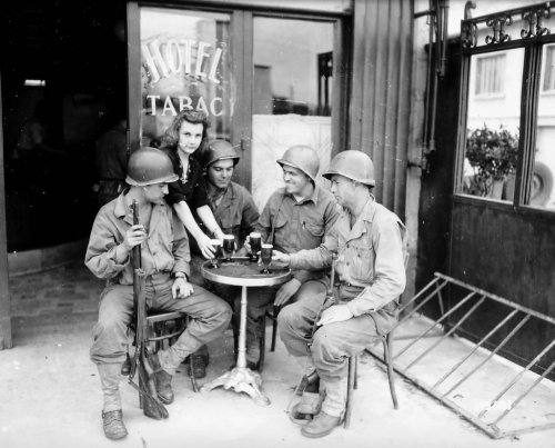 operationbarbarossa:GIs of the 79th Infantry Division enjoy a cold one at a pub in Mantes-la-Jolie, 