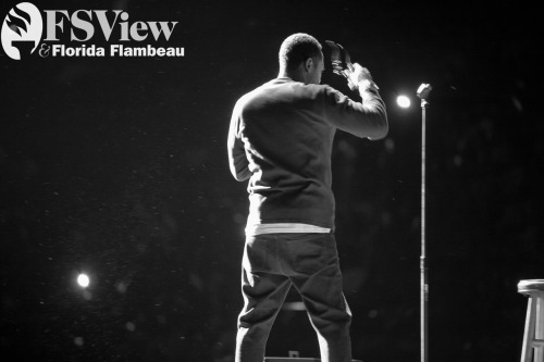 Mike Epps enters the stage and takes off his sunglasses. Comedian Mike Epps and supporting acts performed at the Tallahassee Leon County Civic Center on November 10 2012.