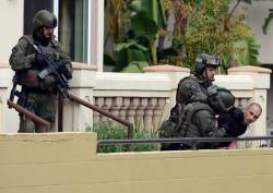 seizethe-night:  FBI SWAT team members arrest a man after storming a townhouse in the 4300 Stern Ave in Sherman Oaks Wednesday, February 15, 2011. 