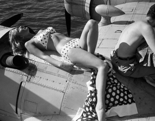 Resting on the wing of a Consolidated PBY-5A; photo for Life by Loomis Dean, 1950.
