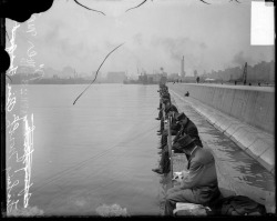 Men fishing from North Pier, sitting along
