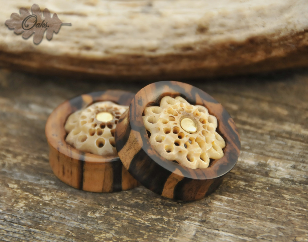 oaksplugs:  1”1/2 Black and white ebony with carved deer antler inlay and brass