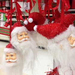 The way these ornaments are hanging it looks like a bunch of beheaded Santa heads.