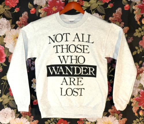 wickedclothes:  BACK IN STOCK: Wicked Clothes is proud to present our first sweater and our latest item: the ‘Those Who Wander’ Sweater! These flew off the shelves last time, so if you want one, order as quickly as you can! On top of being on sale