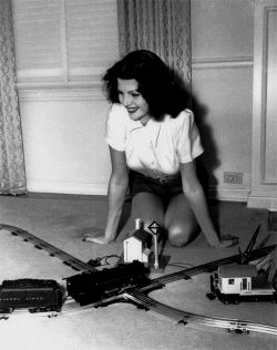  A young Rita Hayworth with her Lionel train set, c. late 1930’s 