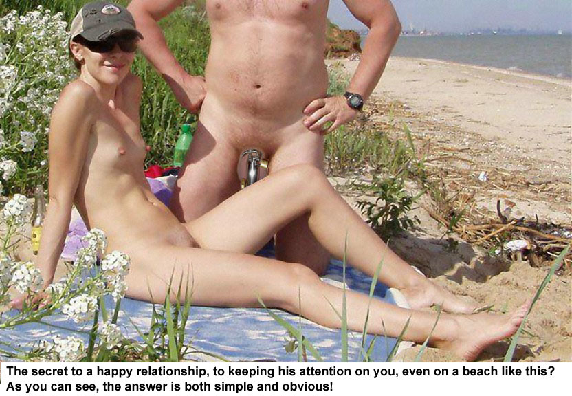 Another nudist beach shot to which a chastity device has been added. But the caption