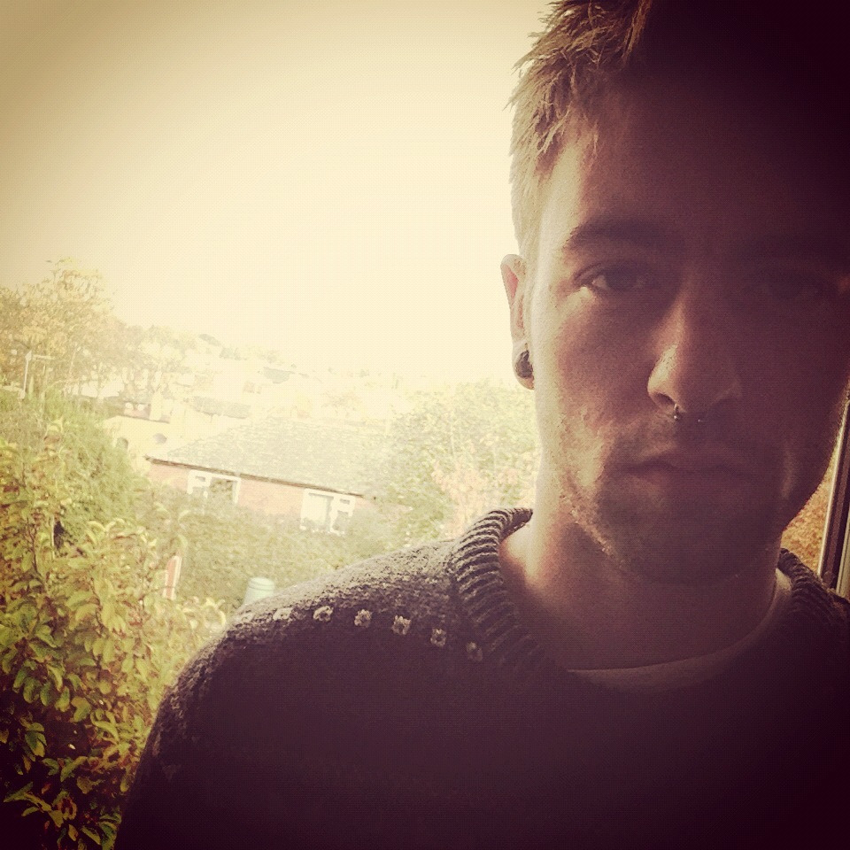 thomasfh:  Cheeky photo my dad got of me while playing with my iphone5 