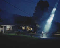 fishingboatproceeds:  cavetocanvas:  Gregory Crewdson, Untitled, 1998 From the Indianapolis Museum of Art:  A solitary man stands in a dark driveway holding a six-pack of beer, spellbound by a shaft of light. Gregory Crewdson has carefully composed each